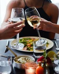 Guests toasting with white wine